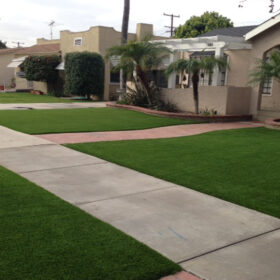 a sidewalk in front of a house