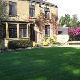 a large lawn in front of a house